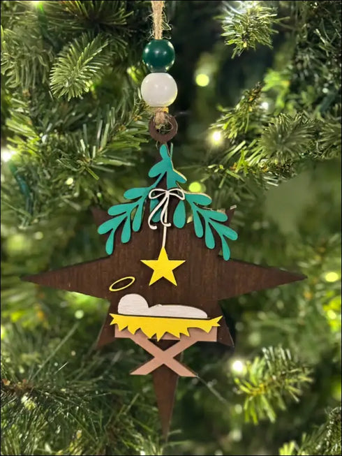 Nativity star ornament for Christmas featuring Baby Jesus in a wooden ornament design