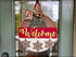 Festive welcome door hanger with Classic Navy Seersucker Romper and Handmade Wooden Santa