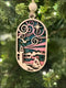 Layered wooden coastal scene ornament featuring a Coastal Lighthouse Ornament design