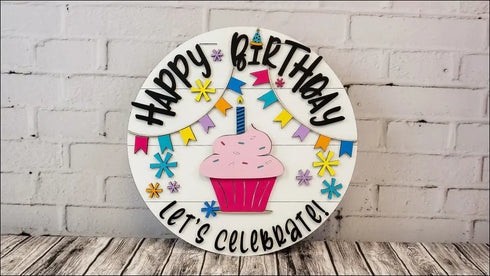 Colorful hand-painted wooden Happy Birthday sign for festive door decoration