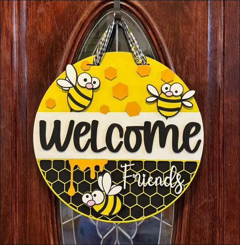 Hand painted round door hanger featuring a bee theme for charming front door decor