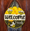 Hand painted round door hanger featuring a bee theme for charming front door decor