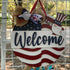 Hand painted wooden welcome sign with American flag theme for outdoor home decor