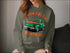 Olive-green sweatshirt with pumpkin truck design for hand-picked farm fresh pumpkins