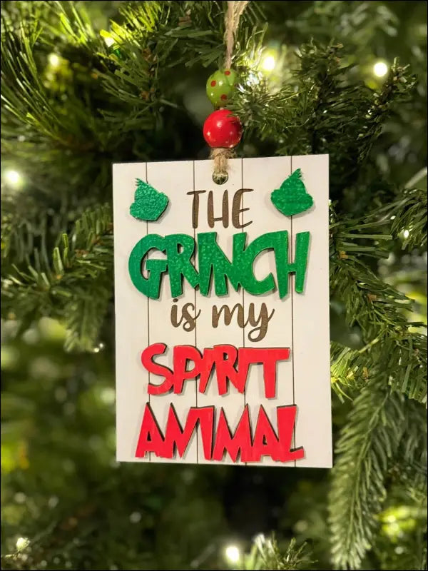 Handmade wooden Grinch Spirit Animal Christmas ornament for festive holiday decor
