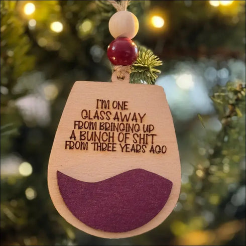 Wooden Christmas ornament with humorous wine-themed engraving for holiday decorating