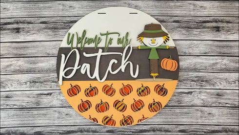 Fall-themed circular door hanger for autumn home decor with rustic pumpkin patch design