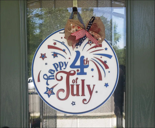 Patriotic July 4th door hanger featuring a hand painted wooden sign for Independence Day
