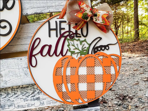 Round fall pumpkin wood door hanger with plaid design and decorative bow for rustic fall decor
