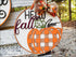 Round fall pumpkin wood door hanger with plaid design and decorative bow for rustic fall decor
