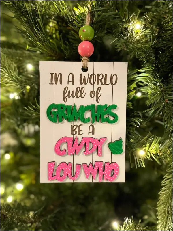 Handmade wooden Christmas ornament featuring Grinch-themed Cindy Lou Who message