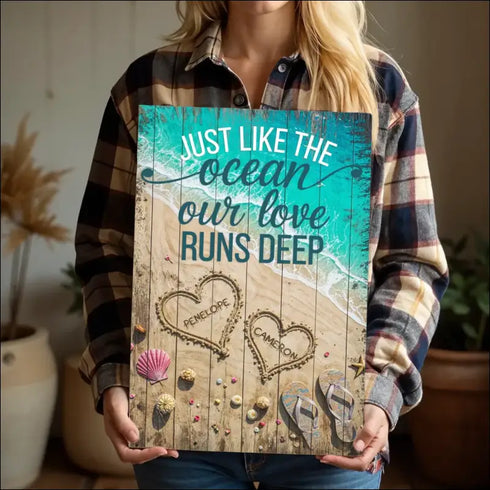 Rustic canvas print of beach scene with love runs deep engraving