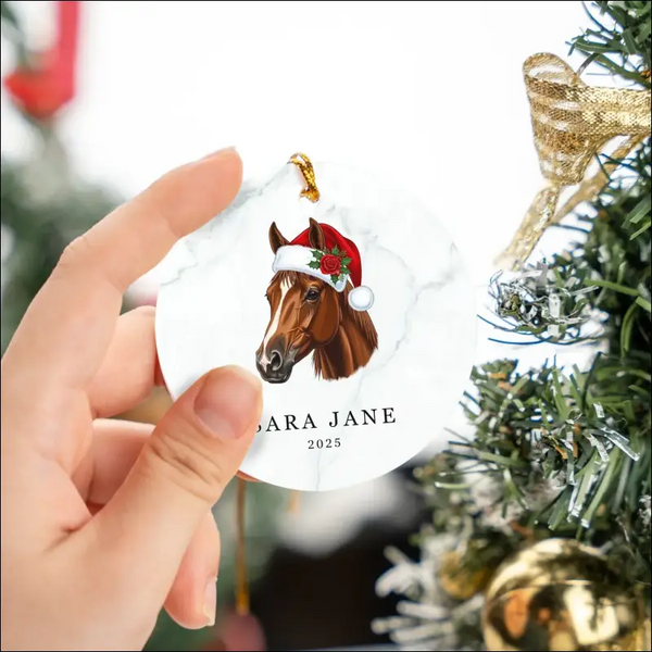 Personalized 2025 horse ornament in white ceramic with Santa hat and holly