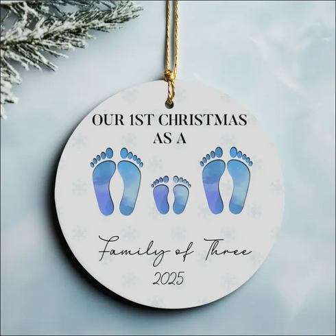 Personalized Our First Family Christmas 2025 ceramic ornament with blue footprints