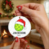 High-quality white ceramic Christmas ornament with lime green and red Santa hat design