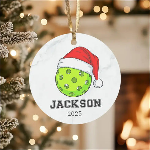 Lime green pickleball ornament with Santa hat design in high-quality white ceramic