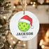 Lime green pickleball ornament with Santa hat design in high-quality white ceramic