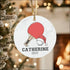 High-quality white ceramic personalized ping pong ornament with red paddle and Santa hat design