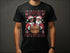 Black t-shirt with Christmas-themed graphic.