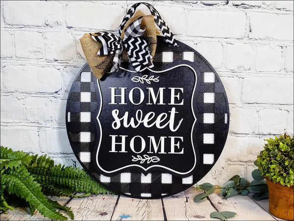 Round black and white checkered door hanger sign for rustic hand-painted home decor