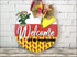 Round wooden door hanger sign with a Mexican theme Welcome But Did You Bring Tacos