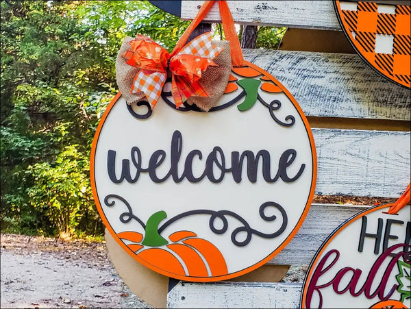 Round Welcome Pumpkin Wood Door Hanger with decorative bow for rustic farmhouse entryway