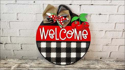 Round welcome sign with cherries and bow, handmade wooden decor for rustic home entryway