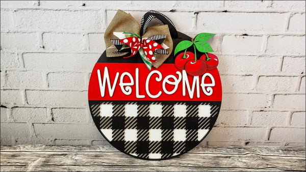 Round welcome sign with cherries and bow, handmade wooden decor for rustic home entryway